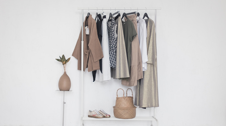 Clothes and accessories hanging on a clothing rack