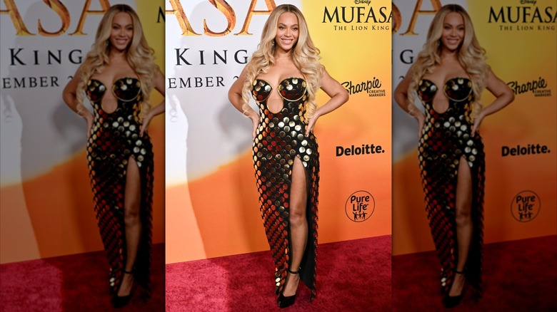 Beyoncé in gold beaded strapless gown with thigh high slit blonde hair down