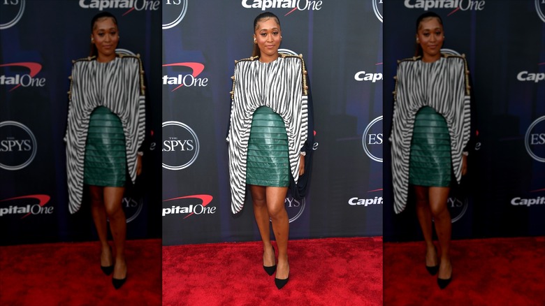 Naomi Osaka in a Zebra print tunic-like top tucked into a horizontally pleated leather skirt on the red carpet of the 2021 ESPYs awards.