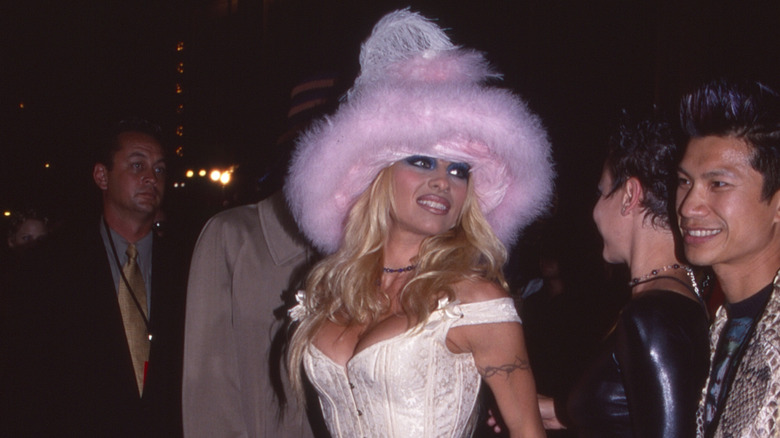 Pamela Anderson wearing a fuzzy pink hat at the MTV VMAs