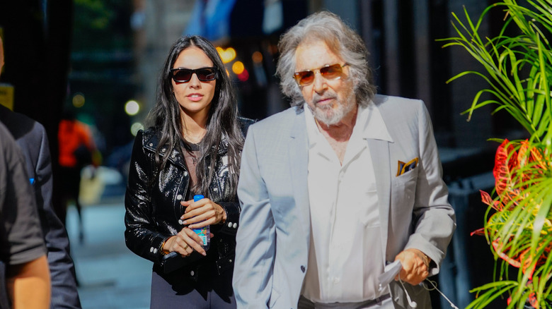 Al Pacino and Noor Alfallah walking in public