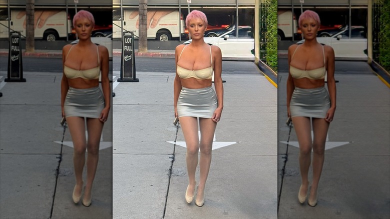 Bianca Censori walking in a parking lot