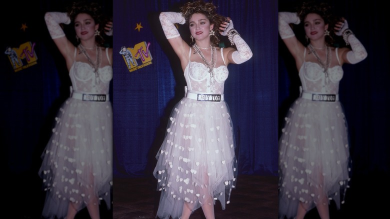 Madonna posing at VMAs in 1984