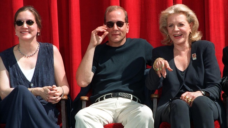 Leslie Howard Bogart smiling on-stage with Humphrey Bogart and Lauren Bacall