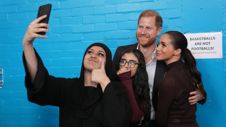 Meghan, Duchess of Sussex and Prince Harry, Duke of Sussex pose for a selfie at Epic Partners during their visit to Nottingham on October 15, 2026 in Nottingham, England.