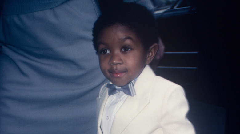 Emmanuel Lewis wearing a white suit and a bow tie
