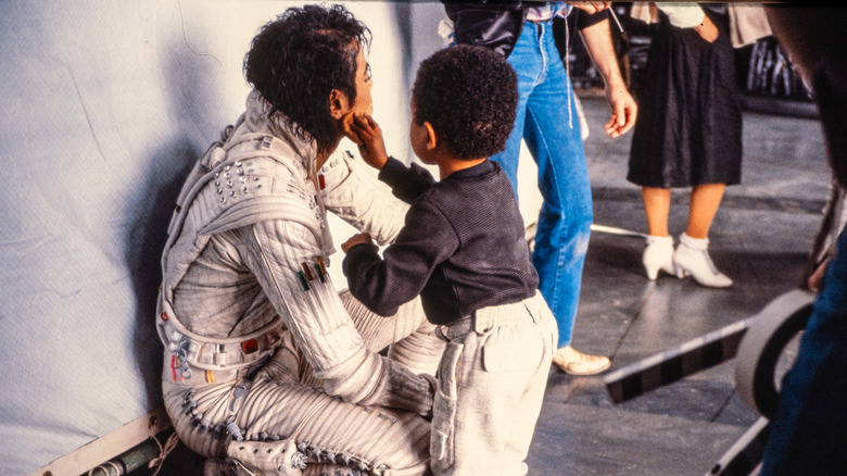 Emmanuel Lewis helping Michael Jackson with his makeup