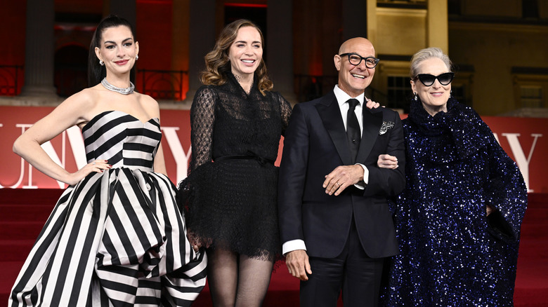 Anne Hathaway, Emily Blunt, Stanley Tucci, and Meryl Streep posing at event