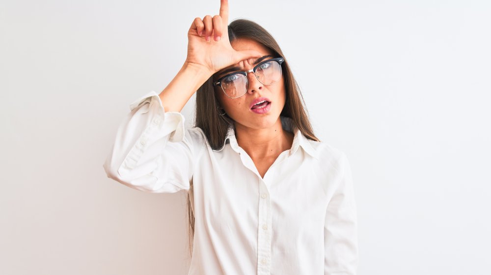 Woman making insulting gesture