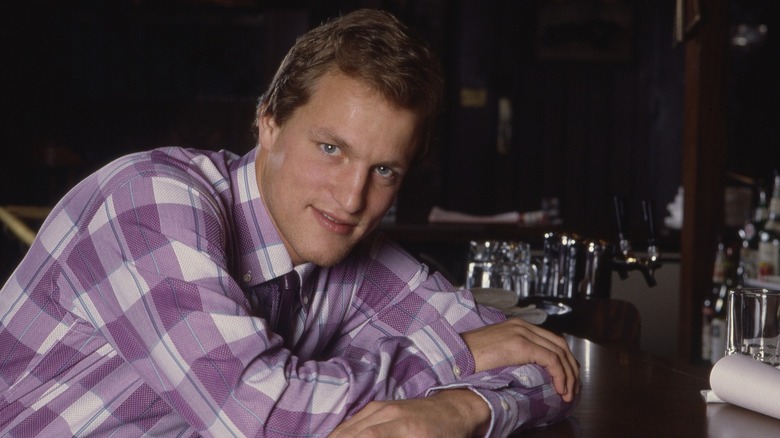 Woody Harrelson poses for a photo on the set of "Cheers" in 1986