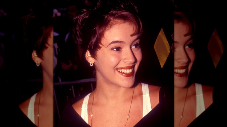 Alyssa Milano smiling for a photo in 1992