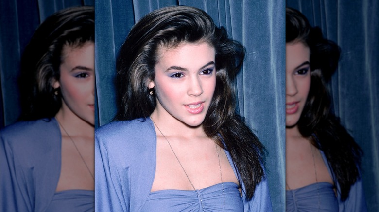 Alyssa Milano wearing a blue dress in a photo from 1990