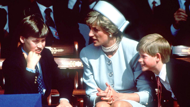 Princess Diana speaking with her sons, Prince William and Prince Harry
