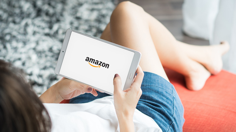 Woman logging into Amazon site on tablet