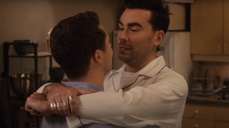 Patrick and David embracing in Schitt's Creek