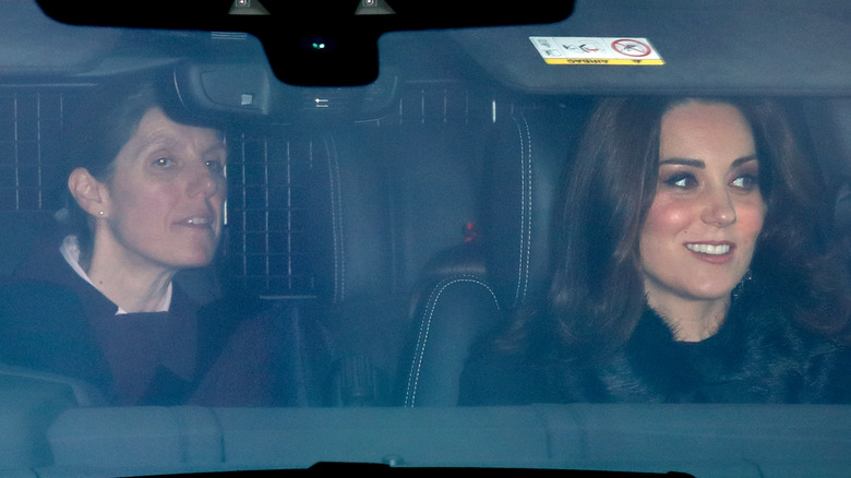 Maria Borrallo in the back seat of a car with Princess Catherine in the passenger seat