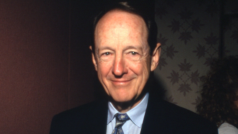William Schallert wearing a suit and smiling in the camera