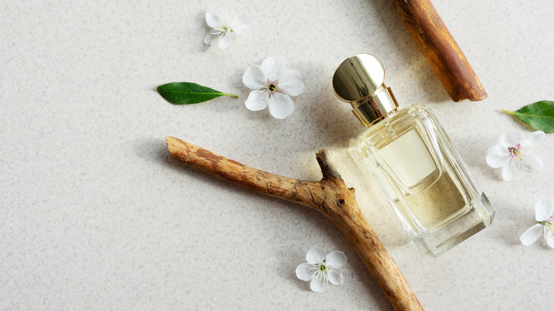 Perfume and flowers flat lay