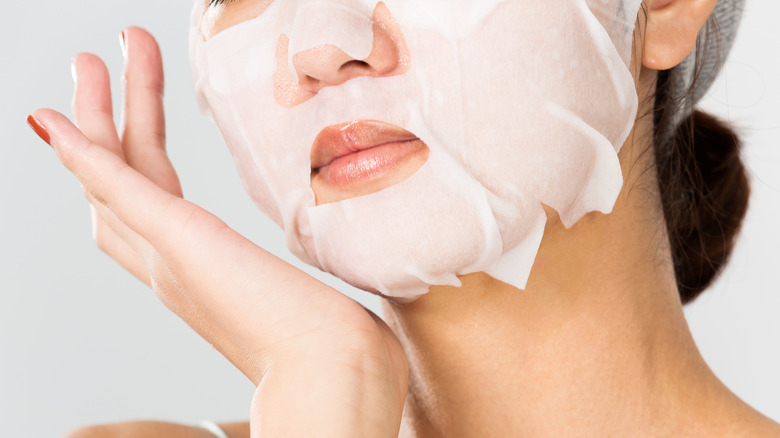 A woman wearing a sheet mask