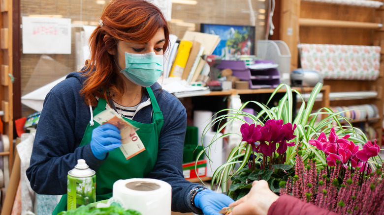 A woman working in a plant nursery