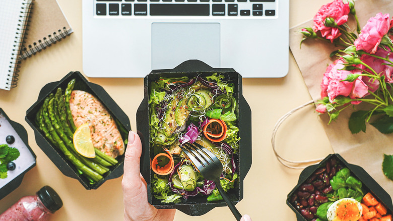 Healthy lunch at the desk with a laptop