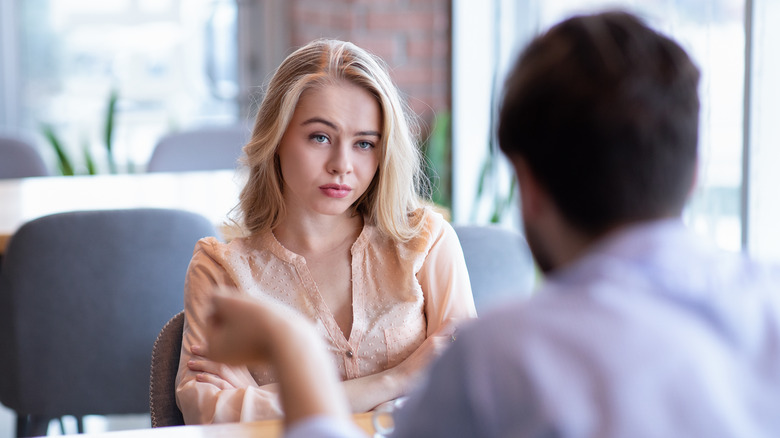 couple talking woman feeling suspicious