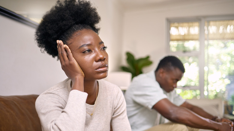 upset couple on sofa