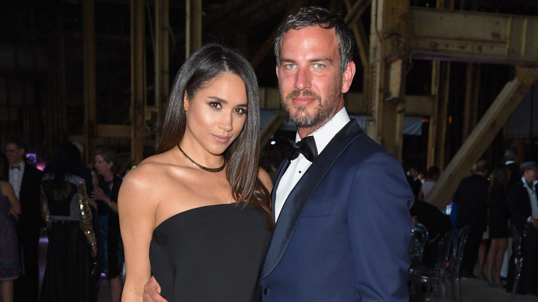 Markus Anderson and Meghan Markle posing at an event