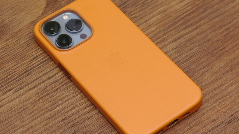 iPhone in an orange-yellow leather case