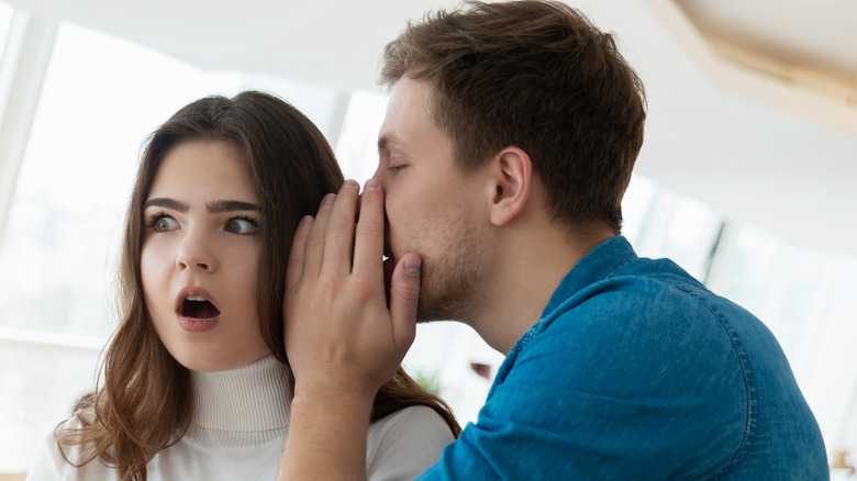 Woman shocked by what man is saying