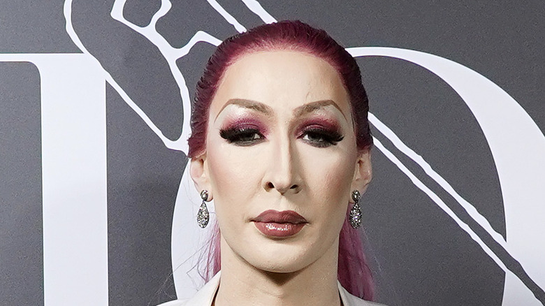 Drag queen Detox poses at a fashion show