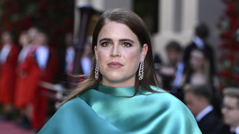princess eugenie poses on the red carpet