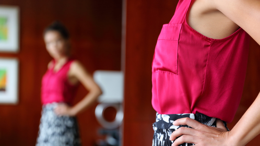 woman looking at her reflection