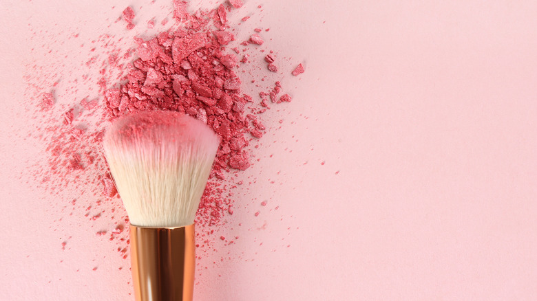brush with pink powder