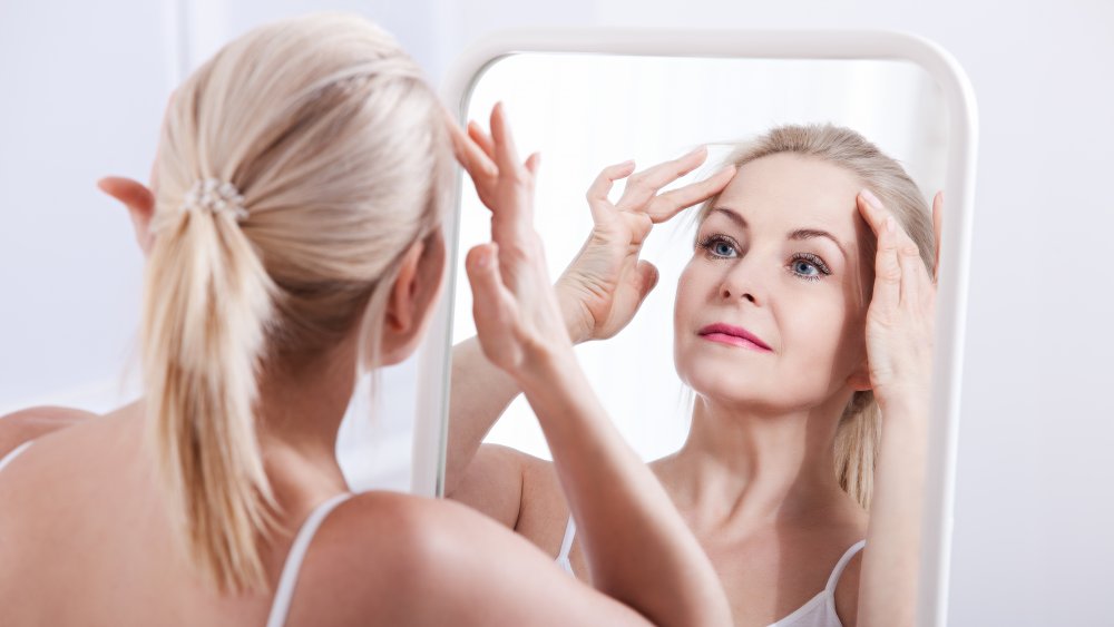 Woman putting on makeup