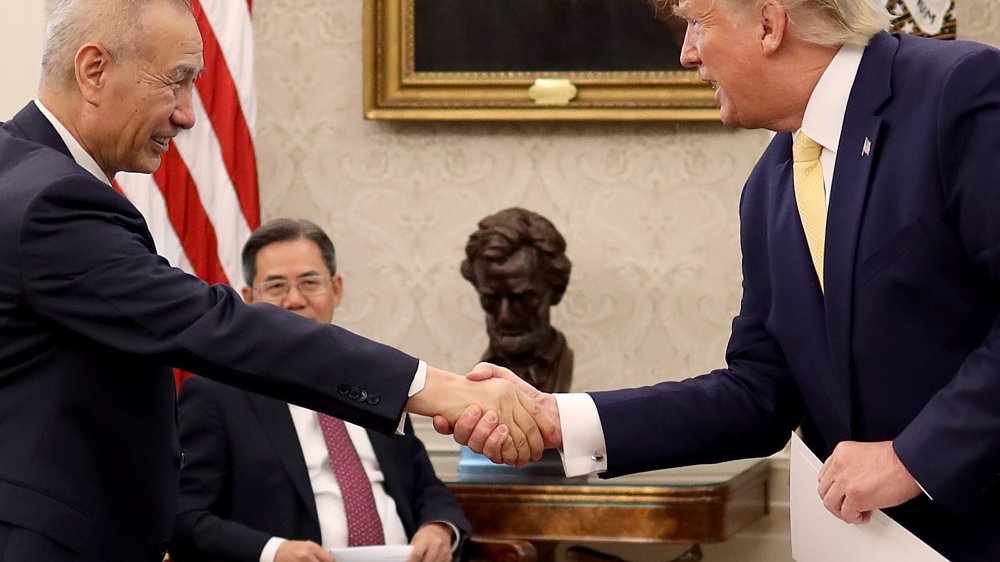 Donald Trump shaking hands with visiting dignitary