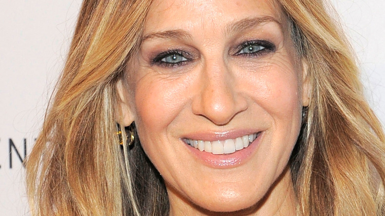 Sarah Jessica Parker smiles with straight hair