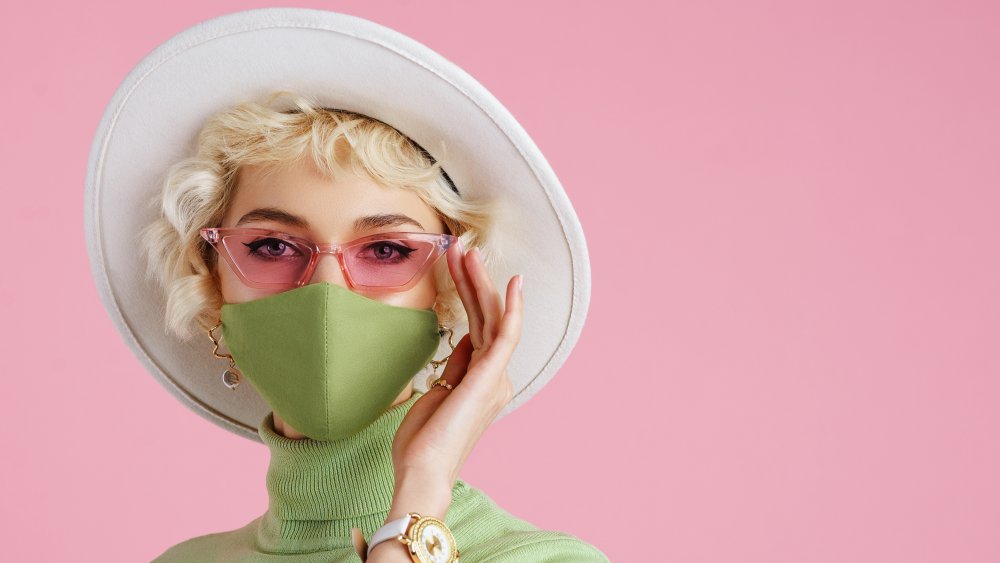 Woman wearing glasses with a face mask