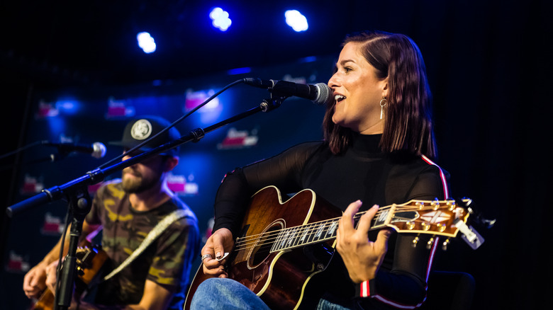 Cassadee Pope playing guitar