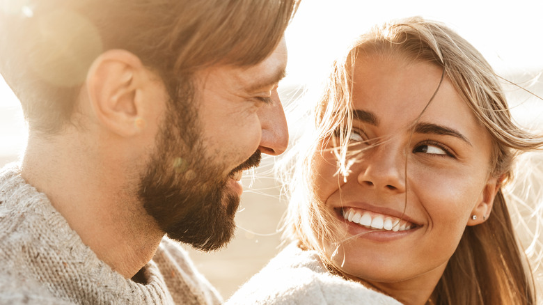 lovers smiling and staring at each other