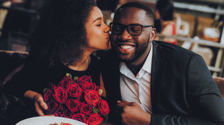 woman kissing man