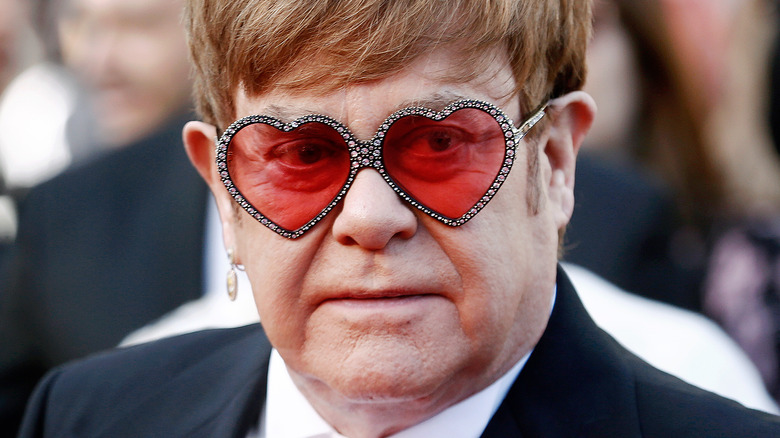 Elton John with heart-shaped glasses
