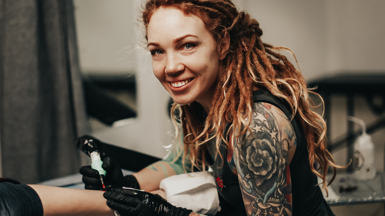 tattoo artist doing a tattoo