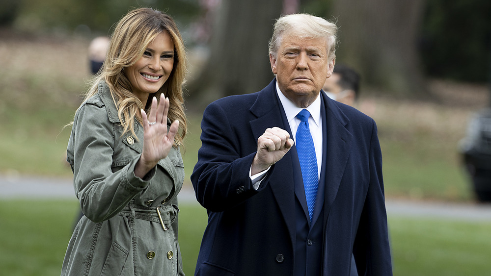 Donald and Melania Trump hold hands