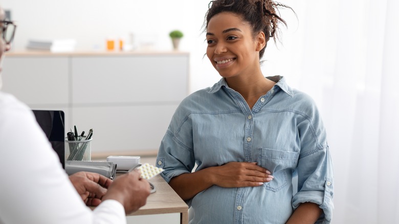 pregnant woman at doctor's appointment