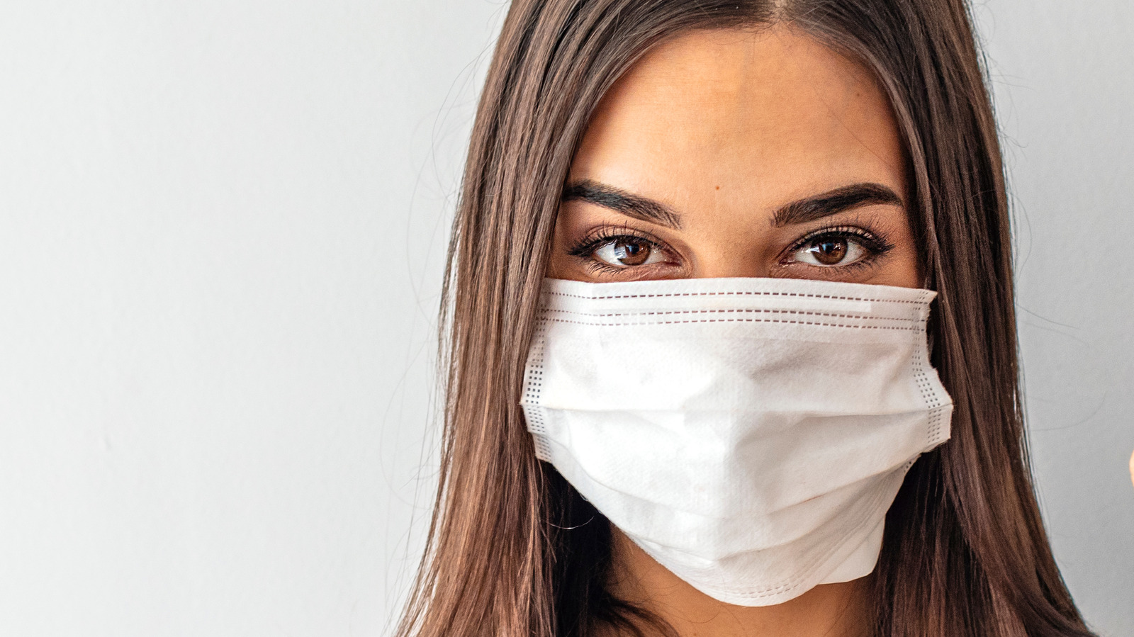 This Is How You Should Be Wearing Your Face Mask, According To A Health