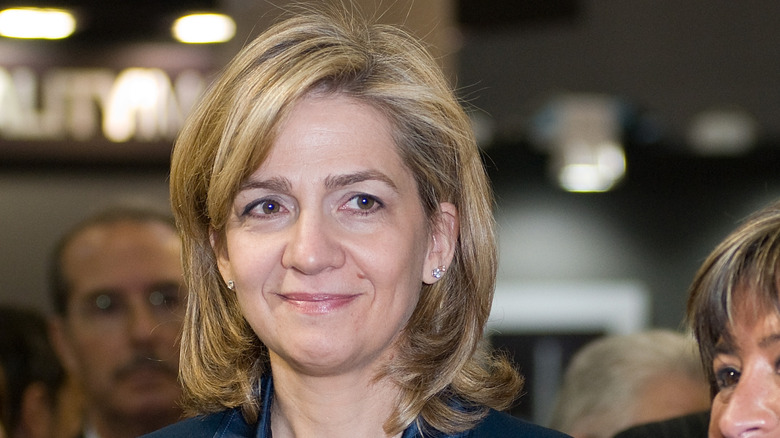 Princess Cristina smiling at distant object