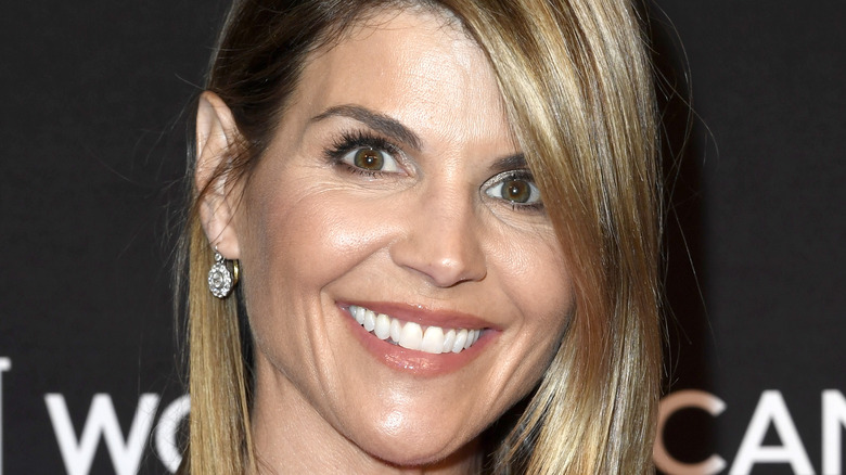 Lori Loughlin smiles on the red carpet.