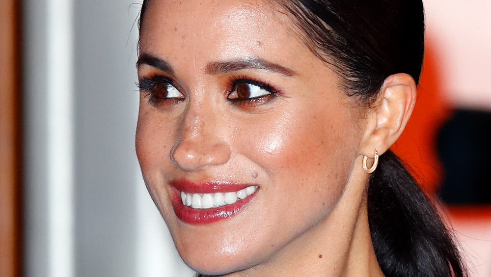 Meghan Markle smiling hair in ponytail