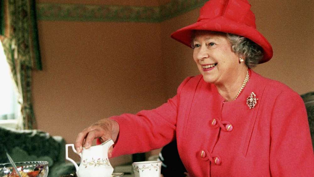 Queen Elizabeth of England drinks tea